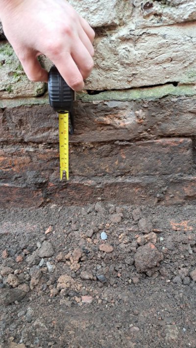 Outside Ground Levels - With Tape Measure.jpeg Outside Ground Levels - With Tape Measure.jpeg